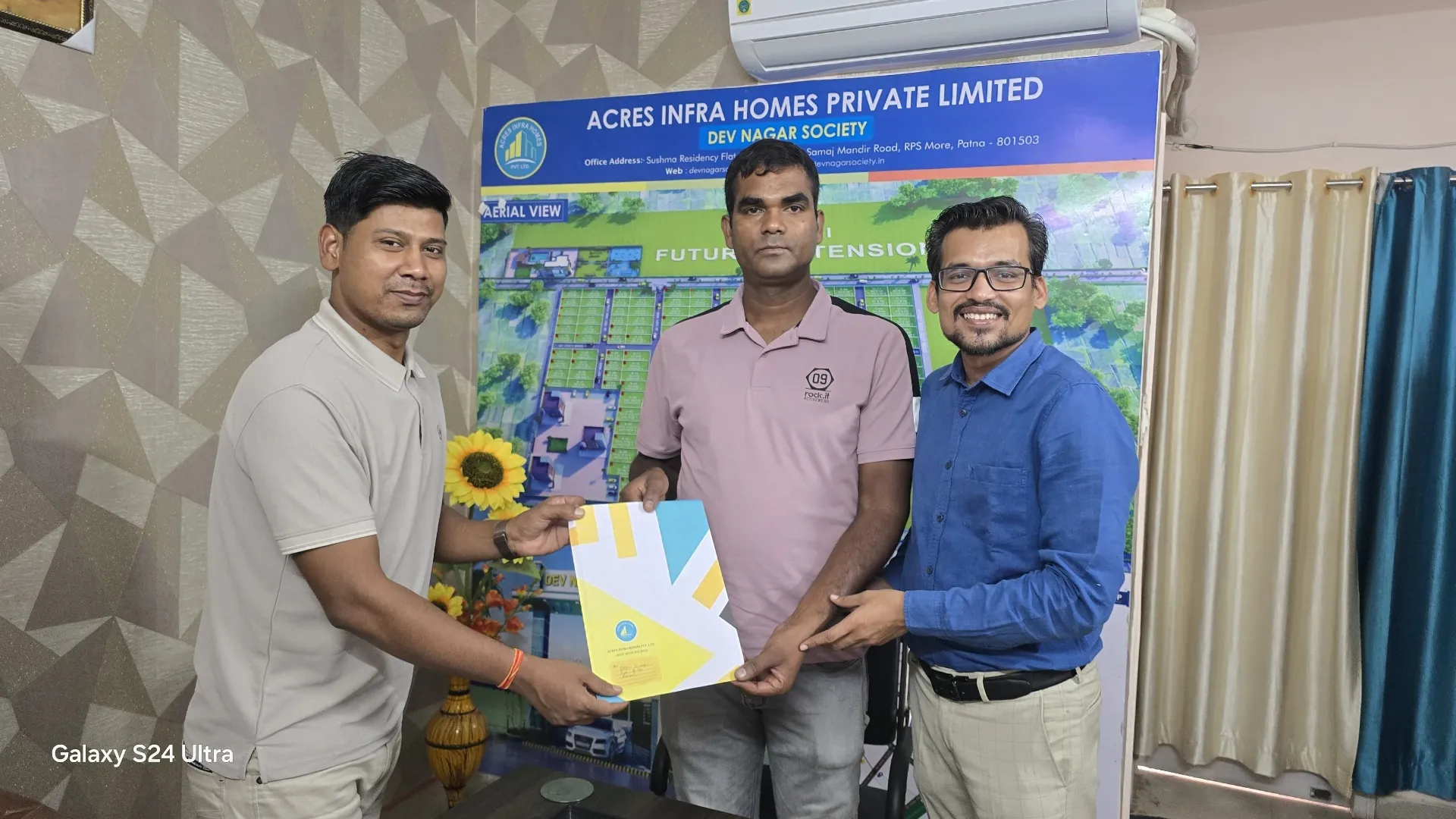 Dwarika City — Happy customers receiving plot documents